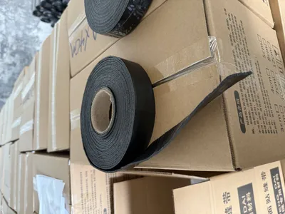 Self-adhesive asphalt seam patching tape for road surface crack repair