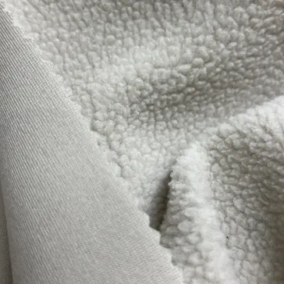 100% Polyester Lambskin-Like Fleeceknitted Fabric for Winter Coats