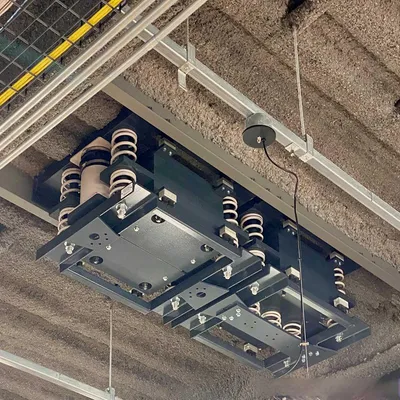 Tuned Mass Dampers for Shock Absorption and Energy Dissipation in High-Rise Building Corridors