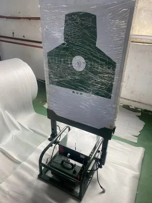 Shock Conducting Integrated Lifting and Reversing Target Machine