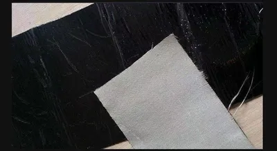 Road surface repair with self-adhesive basalt mesh cracks