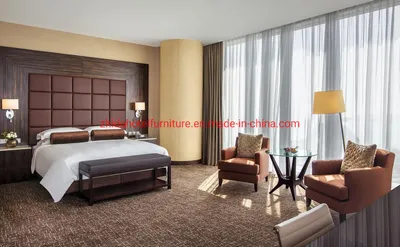 Zhida Latest High Quality Wholesale Modern Design Hotel Furniture Bedroom Set King Size Leather Bed with Check Headboard Wall and Leisure Chair Set
